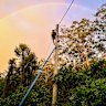 An Energex technician working to restore power after a storm on the Gold Coast.