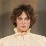 Shaggy bohemian fringes with a “grown out” feel on the Chloé Fall/Winter 2026 runway.