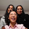 Sisters Sloka and Laysa pose for a photo with their tutor Sophia Ao, who has helped them achieve great school results for the select entry exams.