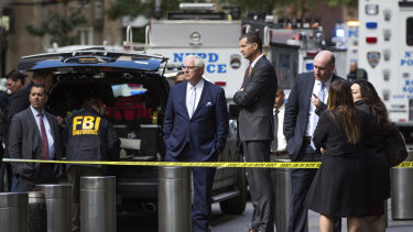 NYPD Deputy Commissioner of Intelligence & Counterterrorism John Miller, centre, arrives outside Time Warner Centre in New York.