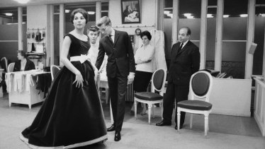 Farah Pahlavi with Yves Saint Laurent in Paris, 1959.