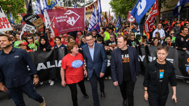 ETU leader Troy Grey (left) and ACTU secretary Sally McManus (right) with Premier Daniel Andrews (middle) at a union rally in Melbourne in January.