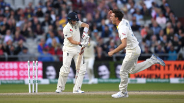 Pat Cummins celebrates bowling Joe Root for a golden duck in Manchester in 2019.