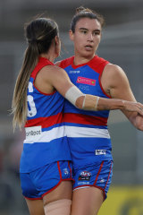 Bonnie Toogood (right) and Elizabeth Snell celebrate a goal.