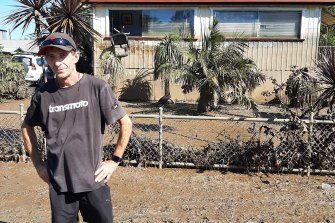 Dean Wilson outside his house in Broadwater, which had never flooded before and is now uninhabitable due to a covering of toxic sludge.