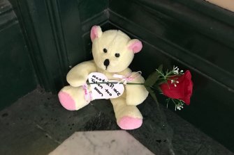 A teddy bear and rose left on the steps of Clarence House after Michaela Dunn was killed there on Tuesday. 