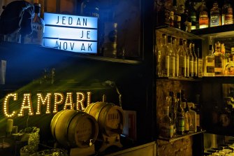 Top shelf: a sign reads ‘Jedan je Novak’ in the Barblija bar in Belgrade.