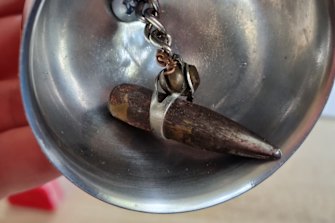 Inside the bell is the bullet that nearly claimed Ginsberg’s life. 