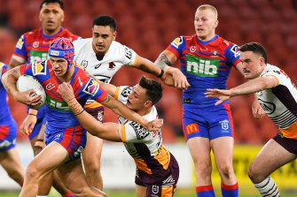 Knights captain Kalyn Ponga makes inroads against Brisbane on Thursday night.