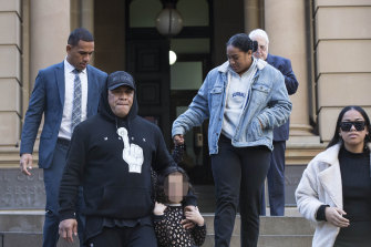 John Hopoate with son and NRL player Will Hopoate at back, and his family leaving the Central Local Court in Sydney. 