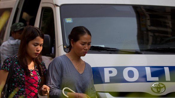 Pan Ei Mon, right, wife of Reuters journalist Wa Lone, walks together with Chit Su Win, left, wife of Reuters journalist Kyaw Soe Oo, as they leave the High Court on Friday.