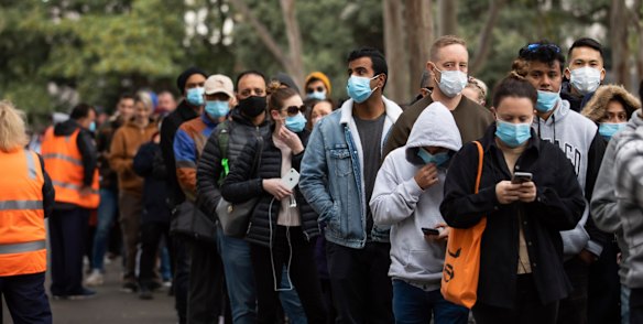 People queue up to receive COVID-19 vaccinations at Sydney Olympic Park.