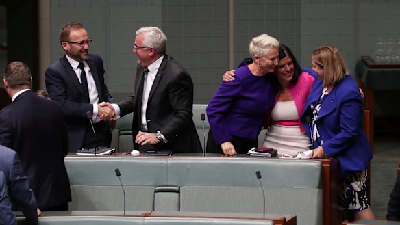 Crossbench MPs Adam Bandt, Andrew Wilkie, Kerryn Phelps, Julia Banks and Rebekha Sharkie celebrate after the medivac bill passes the House of Representatives on Tuesday, February 12, 2019.