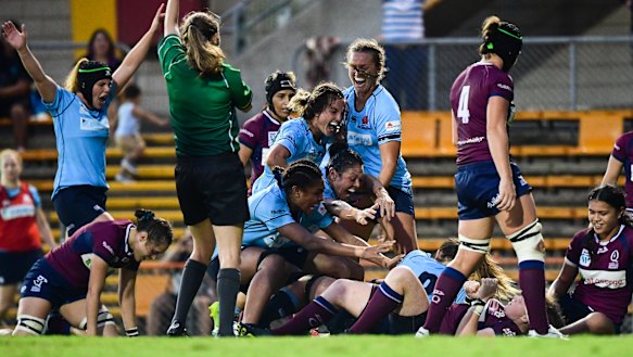 NSW celebrate Grace Hamilton's match-winning second-half try in the Super W final.