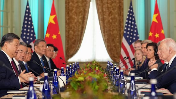 President Joe Biden listens as China’s President President Xi Jinping speaks during their meeting on the sidelines of APEC
