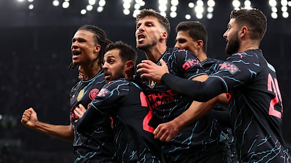 Manchester City celebrate Nathan Ake’s goal.