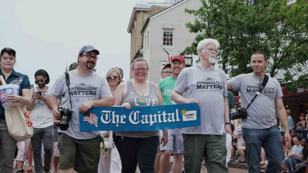 Current and former Capital Gazette staff members march in the Annapolis 4th of July parade.