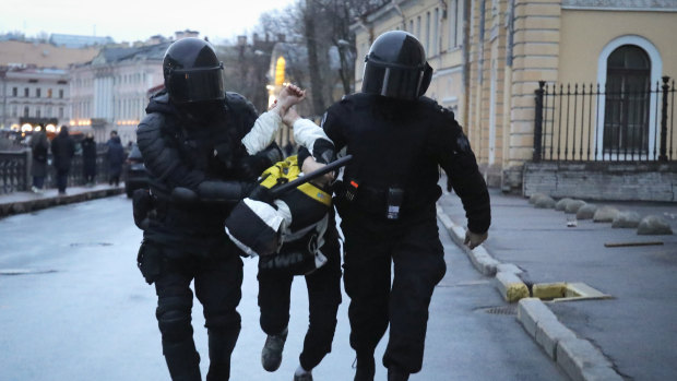 Police detain a man during a protest in St Petersburg, Russia. 