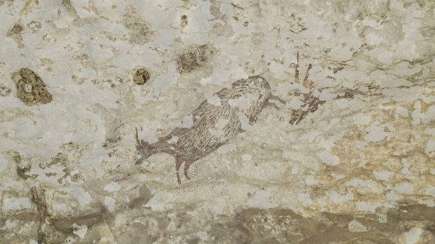 The cave art depicts half-human figures in hunting scenes and has been dated to at least 44,000 years ago.