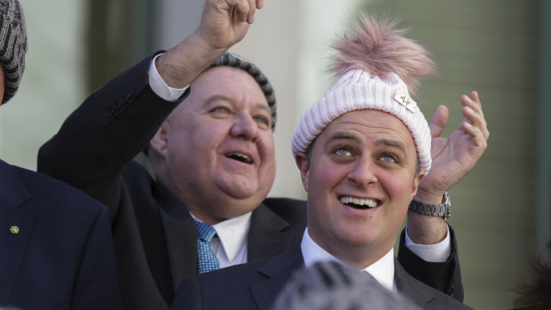 Liberal MP Tim Wilson (right) poses for a photo with a beanie during a brain cancer event at Parliament House