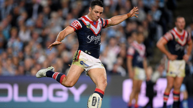 Sharp shooter: Cooper Cronk knocks over  field goal in week one of the finals against Cronulla.