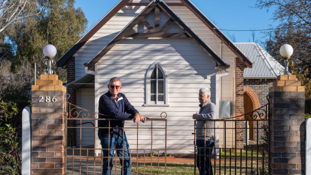 Peter Sanders (left) and his husband Peter Grace in front of St Mary’s Anglican Church, Armidale, where Peter Sanders was paid as an organist and his husband Peter had a volunteer leadership role. 