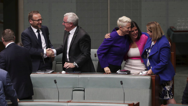 Crossbench MPs Adam Bandt, Andrew Wilkie, Kerryn Phelps, Julia Banks and Rebekha Sharkie celebrate after the medivac bill passes the House of Representatives on Tuesday, February 12, 2019.