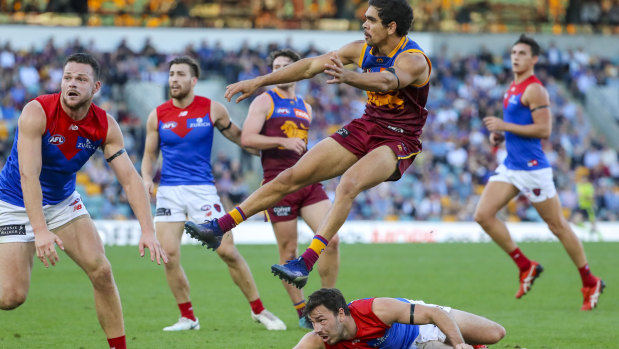 Off to a flier: Brisbane's Charlie Cameron gets airborne at the Gabba.