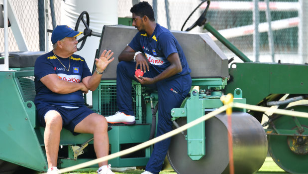 Familiar face: Sri Lanka's Australian bowling coach Steve Rixon gives Lakshan Sandakan some pointers.