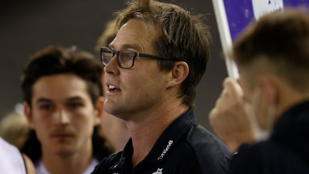 Carlton coach David Teague addresses his players against the Saints.