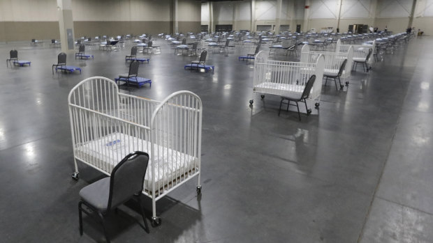 Cots and cribs are arranged at the Mountain America Expo Centre in Sandy, Utah, as an alternative care site or hospital overflow during the COVID-19 pandemic. 