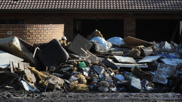 Household items sitting on a layer of mud outside a home on Brisbane Terrace in Goodna on January 15, 2011. 