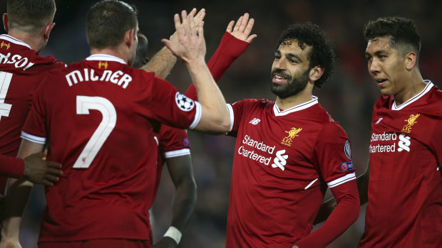 On top: Mo Salah celebrates with teammates after scoring.