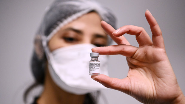 A French health worker with a dose of the Pfizer vaccine.