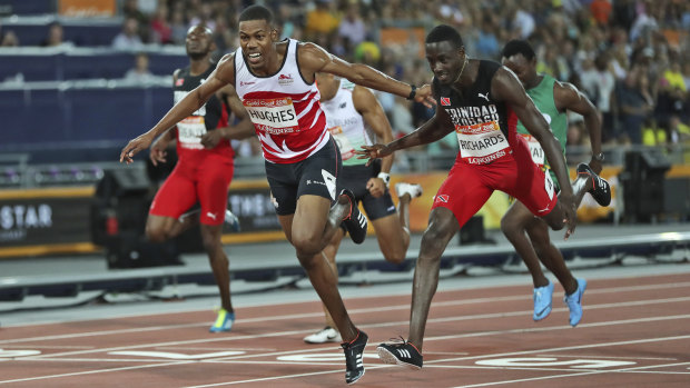 Zharnel Hughes, left, and Jereem Richards cross the line in the 200m final.