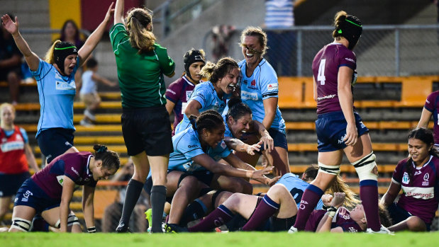 NSW celebrate Grace Hamilton's match-winning second-half try in the Super W final.