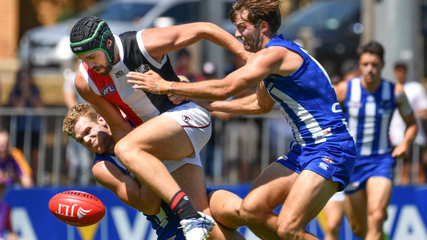 Hot footy: St Kilda's Paddy McCartin leads the race to the ball.