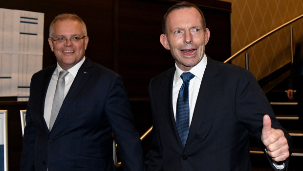 Prime Minister Scott Morrison and former prime minister Tony Abbott arrive at the tribute dinner Thursday night.