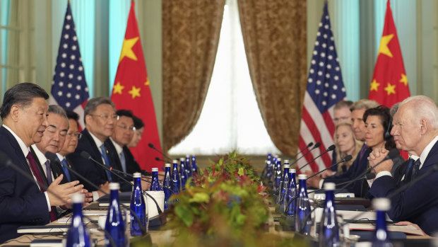 President Joe Biden listens as China’s President President Xi Jinping speaks during their meeting on the sidelines of APEC