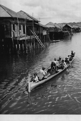 A village scene on the river Kampong, May 1, 1950. 