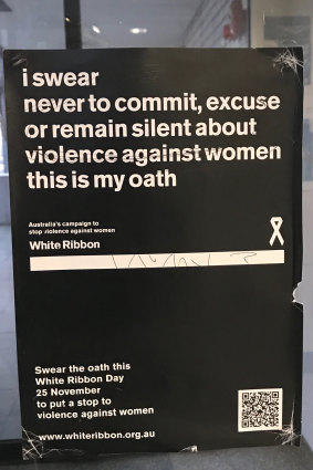 A sign outside of Ballarat Police station, featuring an oath not to commit, excuse or remain silent about violence against women.