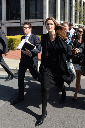 Ben Aulich (left) arriving at court with Peta Credlin. 