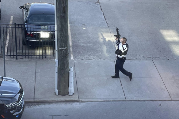 A police officer near the scene of a shooting in Louisville on Monday.