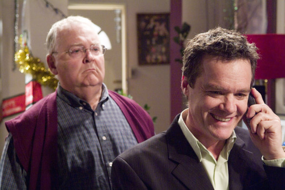 Mobile phones became a new fixture on Neighbours, yet some faces have barely changed, like Harold Bishop (Ian Smith) and Paul Robinson (Stefan Dennis) seen here in a 2005 episode.