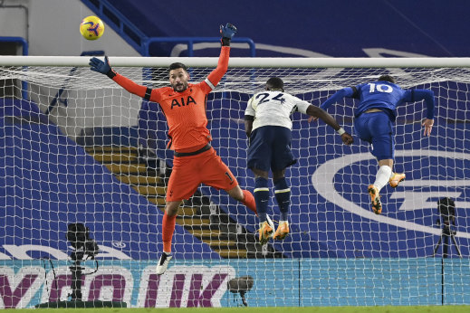 Spurs goalkeeper Hugo Lloris jumps for the ball against Chelsea along with teammate Serge Aurier (centre) and Christian Pulisic of the Blues.