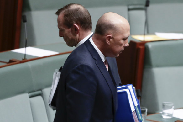 Liberal MPs Tony Abbott and Peter Dutton depart after question time on August 21, 2018.