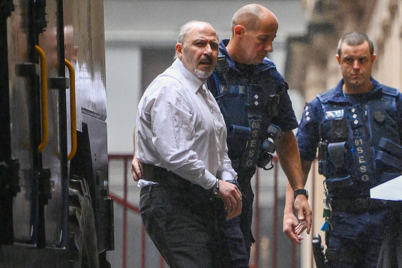 Tony Mokbel being led into court on Monday.