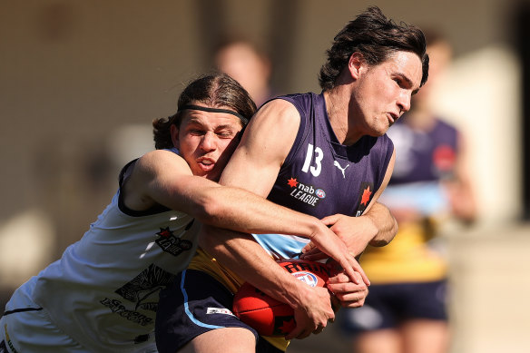 Jhye Clark, playing for Geelong Falcons, lays a tackle.