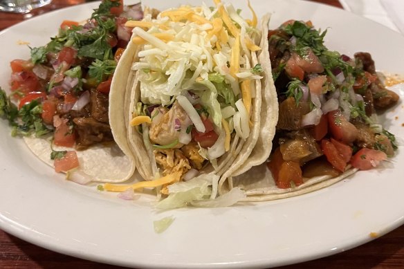 Lengua (beef tongue) and pollo asado (chicken) tacos.