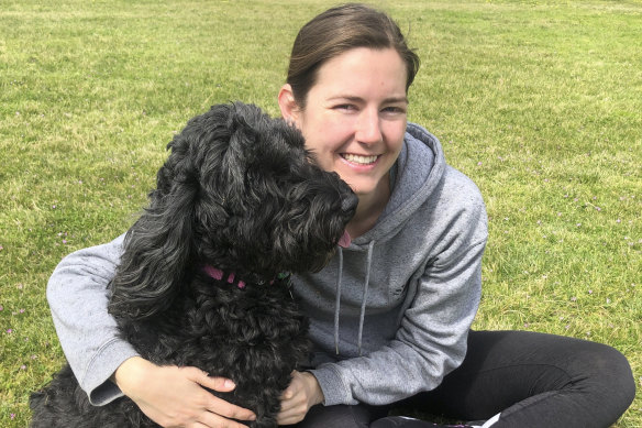 Tegan Stait with Ruby, one of the pampered pooches she house sits.